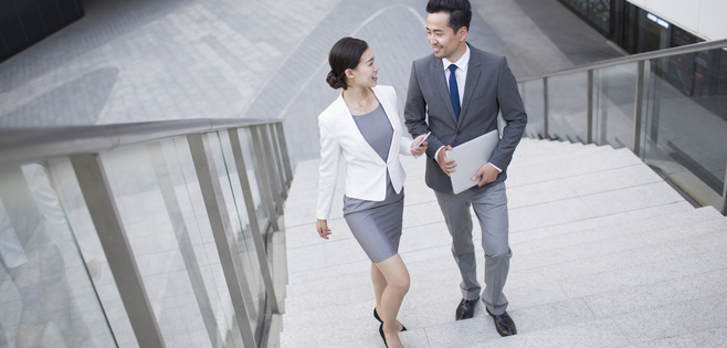 Chinese business person talking on the stairs